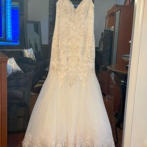 Brand new/never worn, no alterations have been done wedding gown.